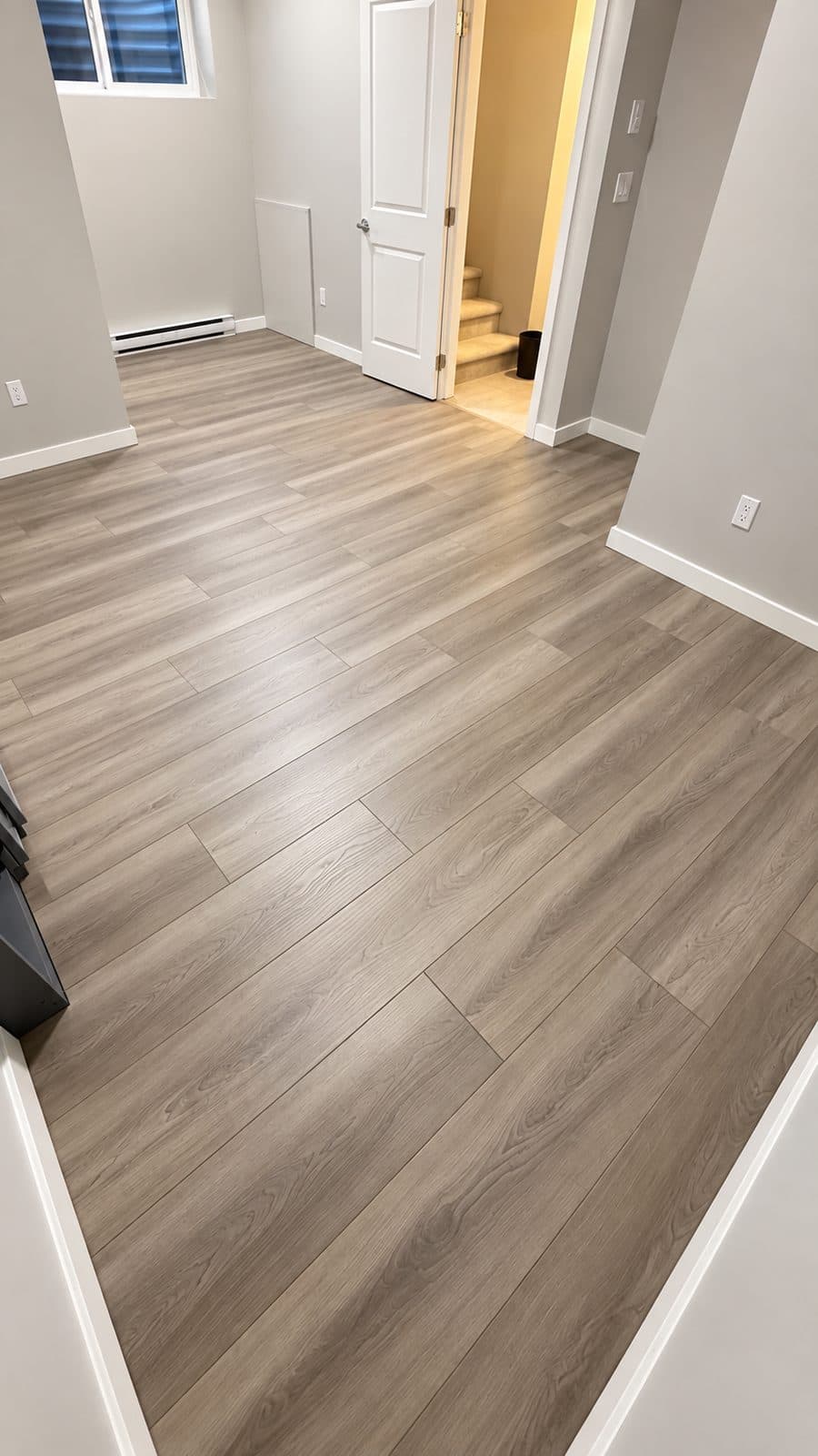 Hallway with grey wood-look plank flooring