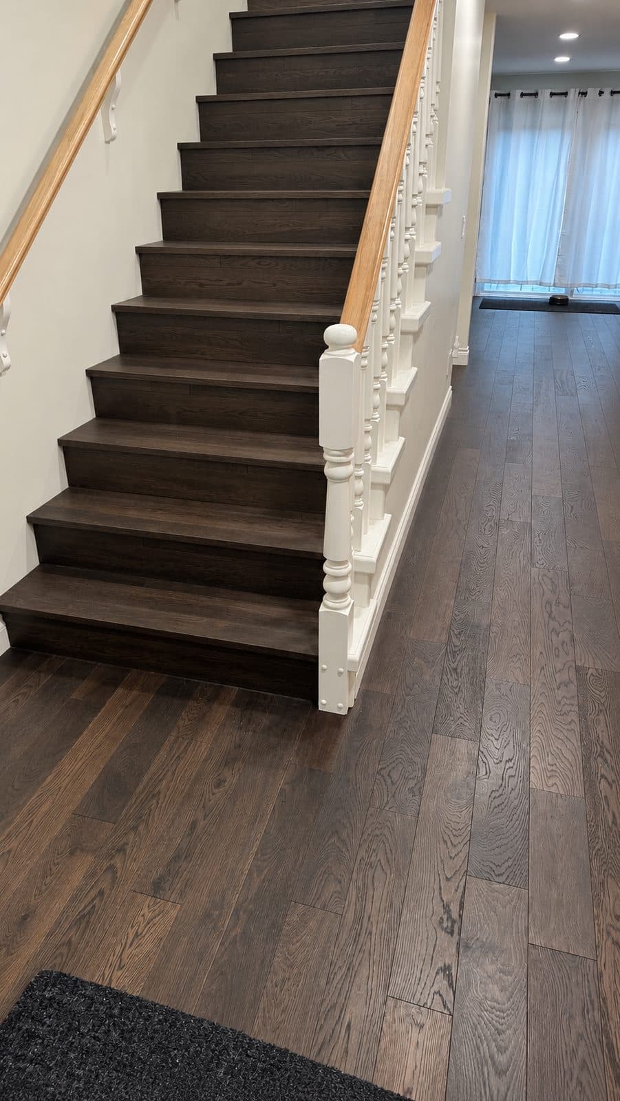 Dark staircase and floor with white spindles