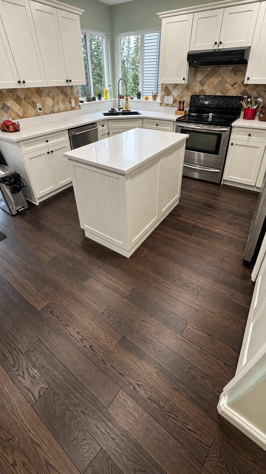 Kitchen with a dark wood floor