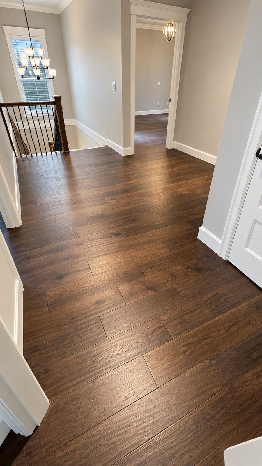 Hallway with a dark wood floor