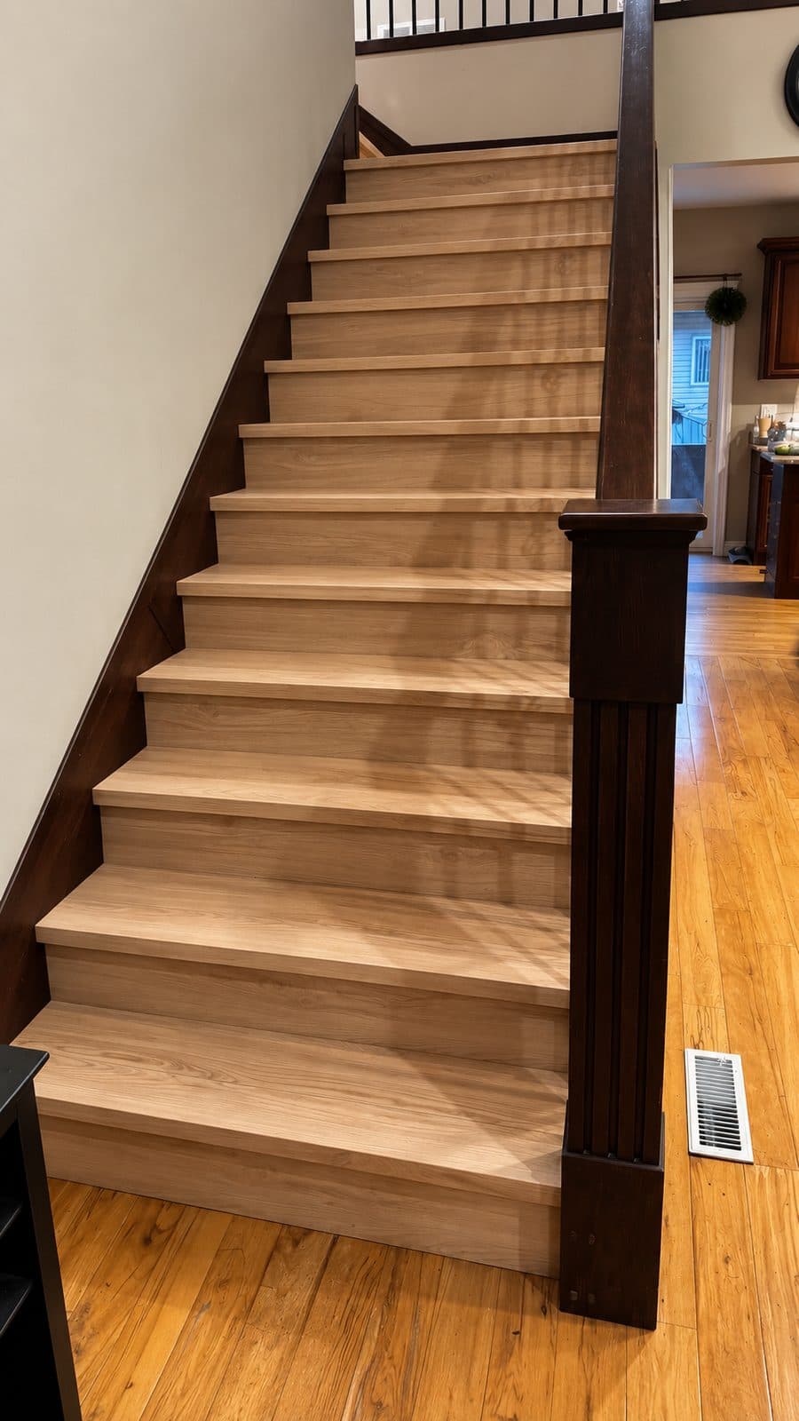 Wood staircase with a dark newel post