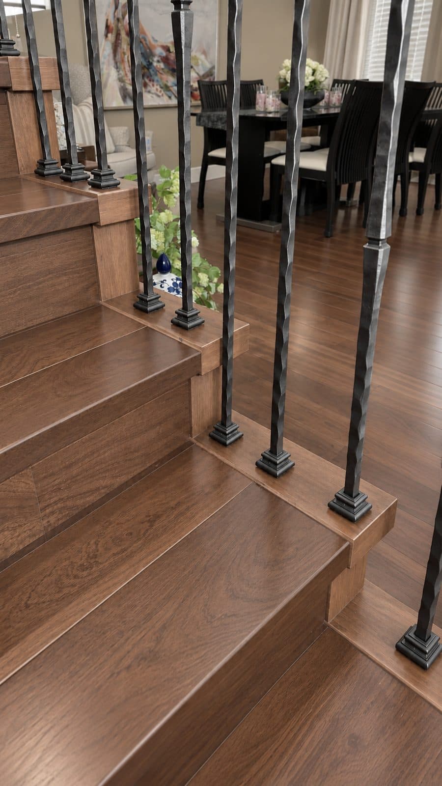 Wood stair treads with wrought-iron balusters