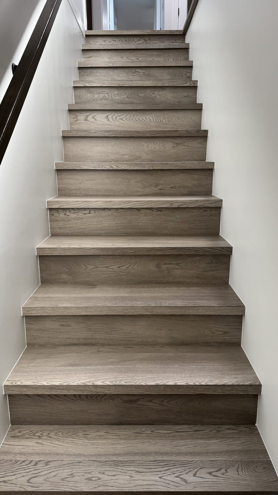 Straight staircase with grey wood treads