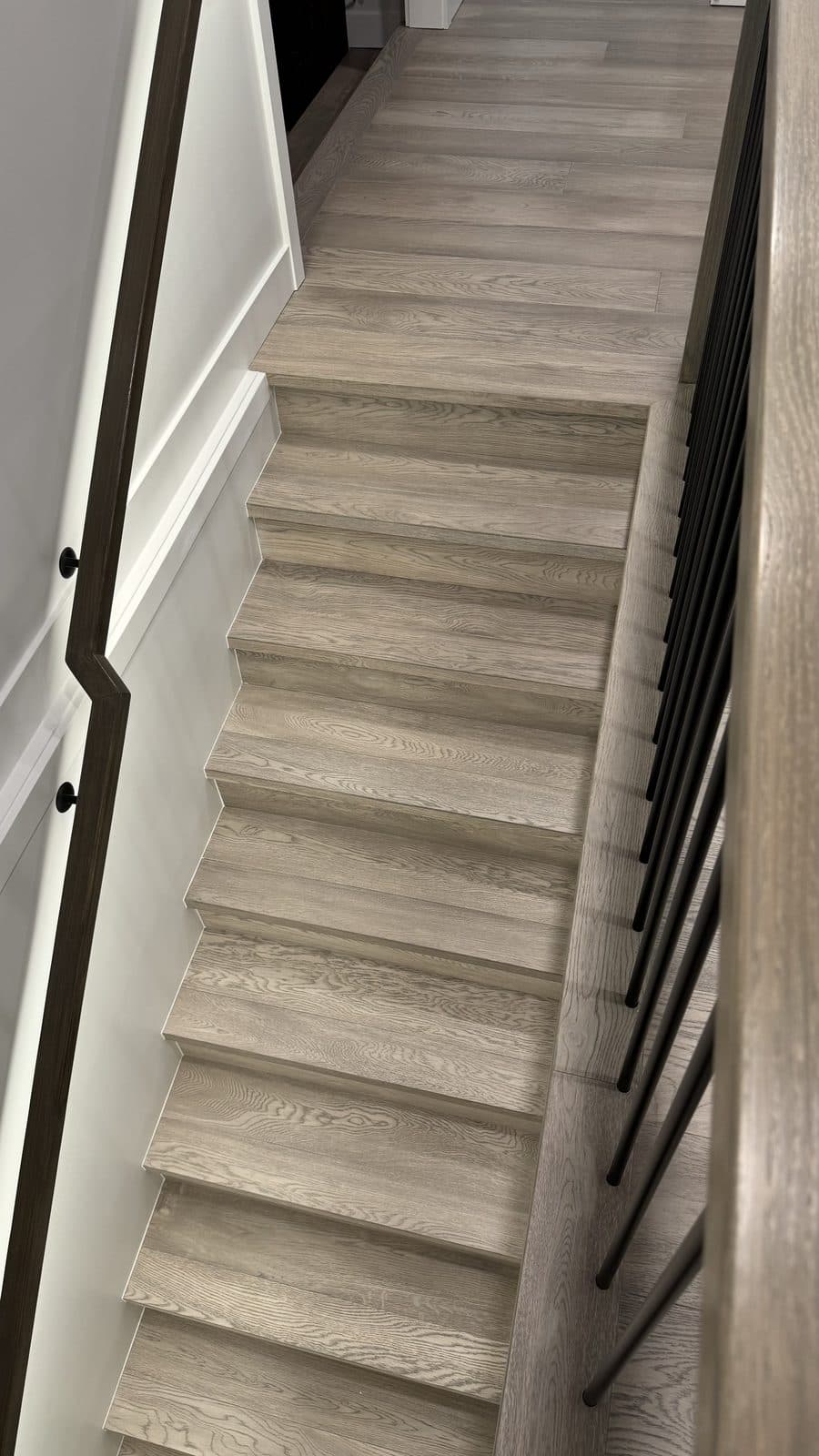 Grey wood staircase seen from above